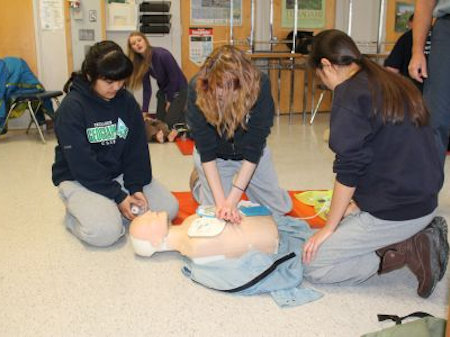 Students learning adult CPR & AED